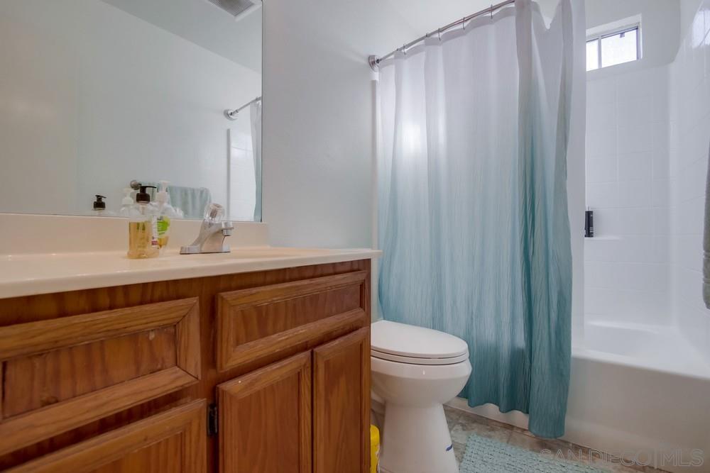 1122 11th Street Imperial Beach, CA 91932 - Photo 16 of 23 a bathroom with a sink a toilet and shower