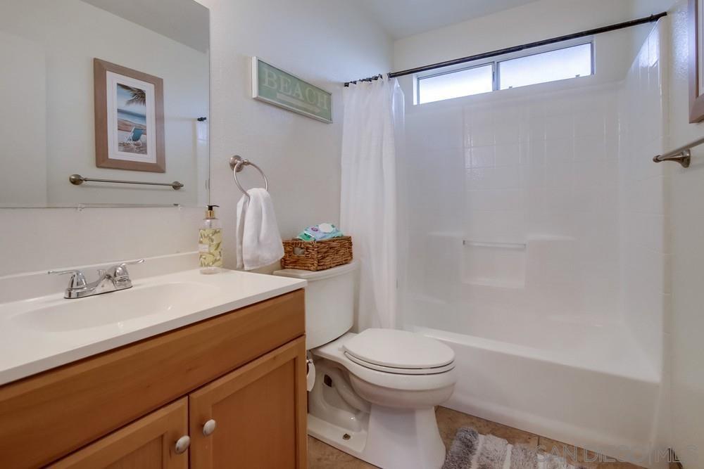 1122 11th Street Imperial Beach, CA 91932 - Photo 19 of 23 a bathroom with a sink a toilet and shower