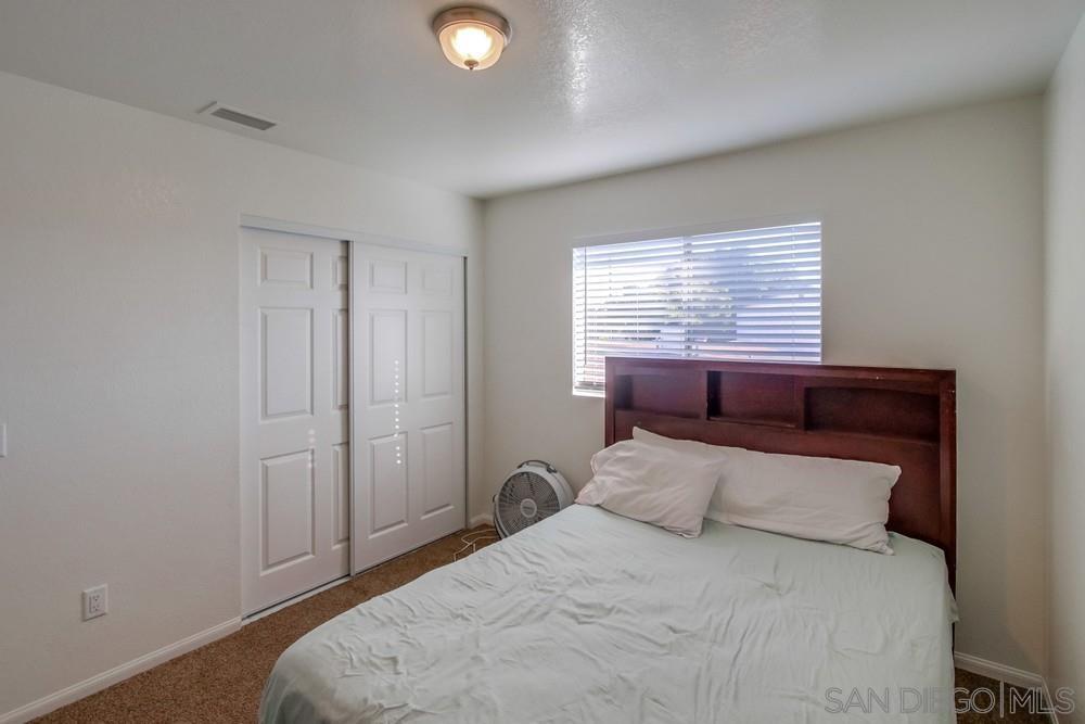 1122 11th Street Imperial Beach, CA 91932 - Photo 20 of 23 a bedroom with a bed and a window