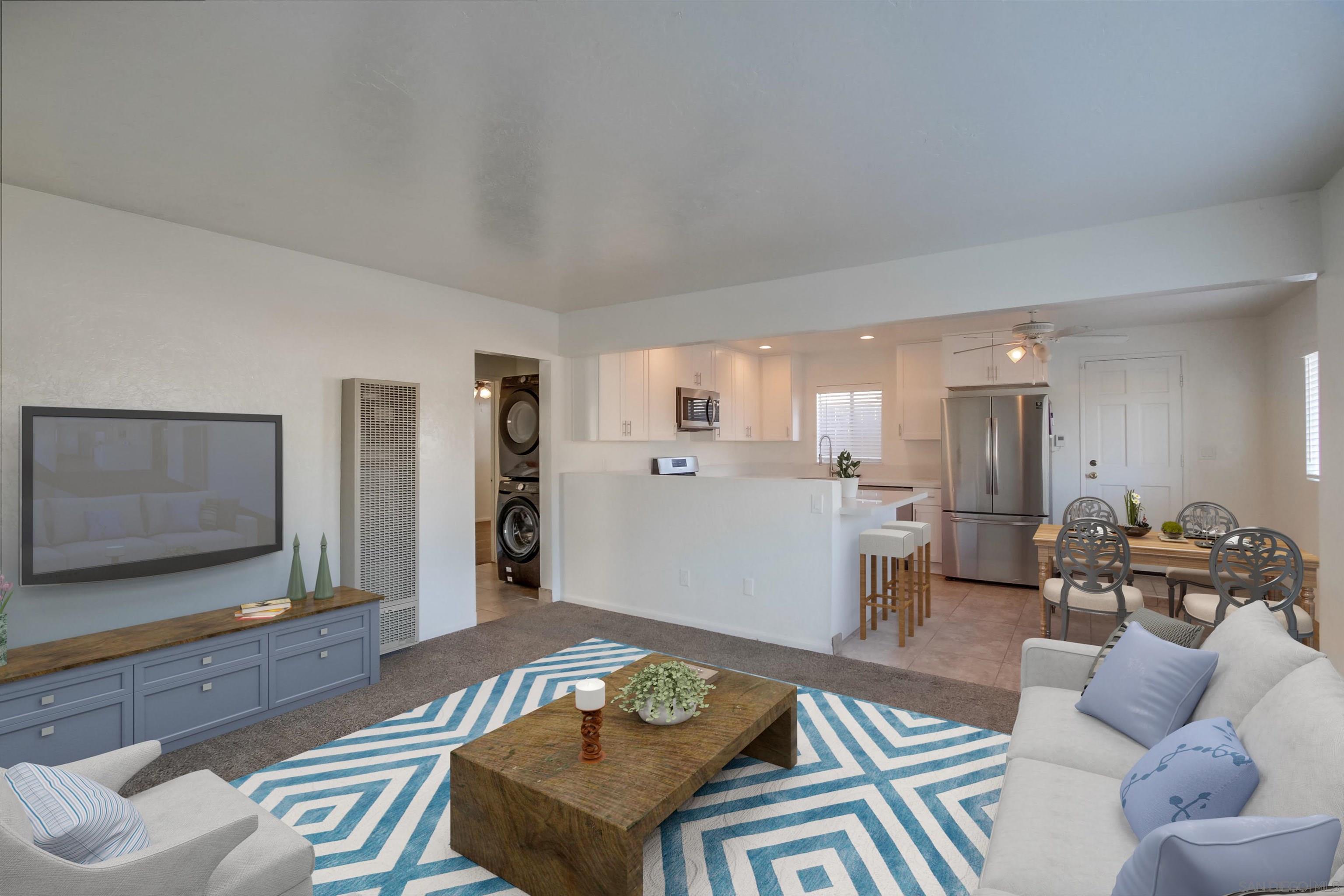 1122 11th Street Imperial Beach, CA 91932 - Photo 3 of 23 a living room with furniture and a flat screen tv