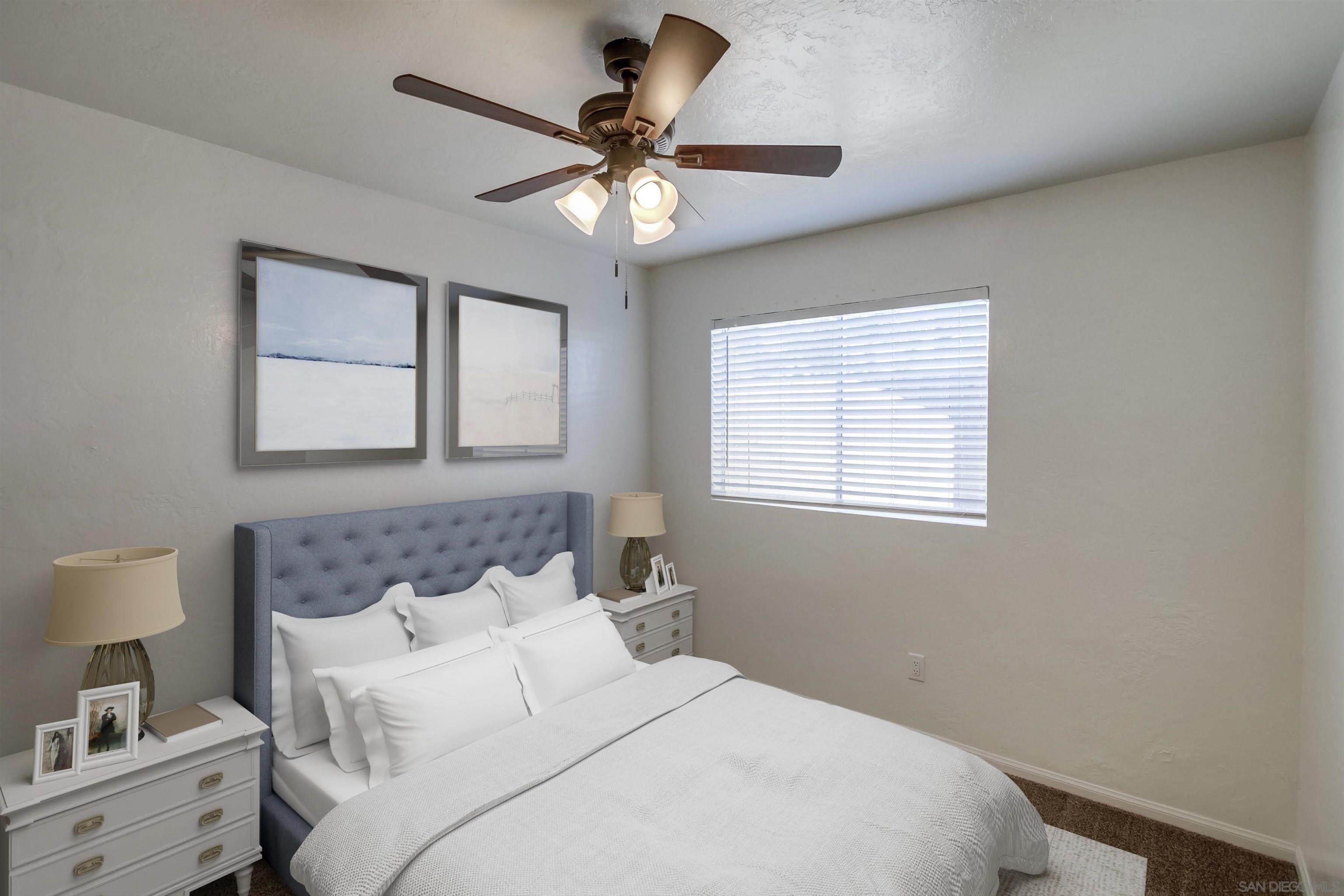 1122 11th Street Imperial Beach, CA 91932 - Photo 7 of 23 a bedroom with a large bed and a window