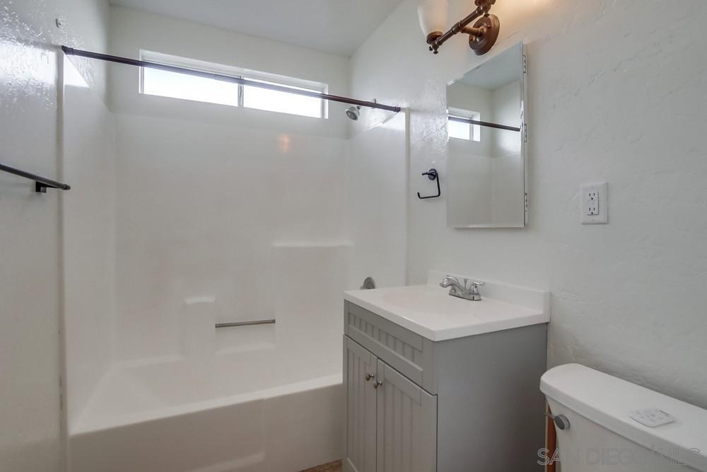 1122 11th Street Imperial Beach, CA 91932 - Photo 9 of 23 a bathroom with a sink toilet and shower