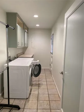 a utility room with washer and dryer