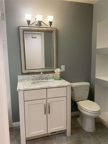 a bathroom with a toilet and a sink