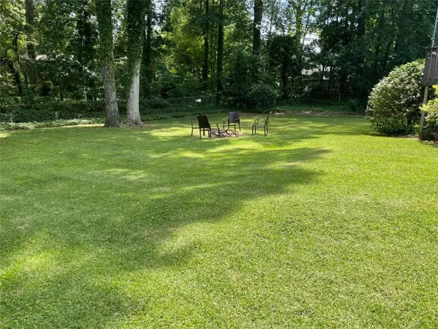 a view of a park with large trees