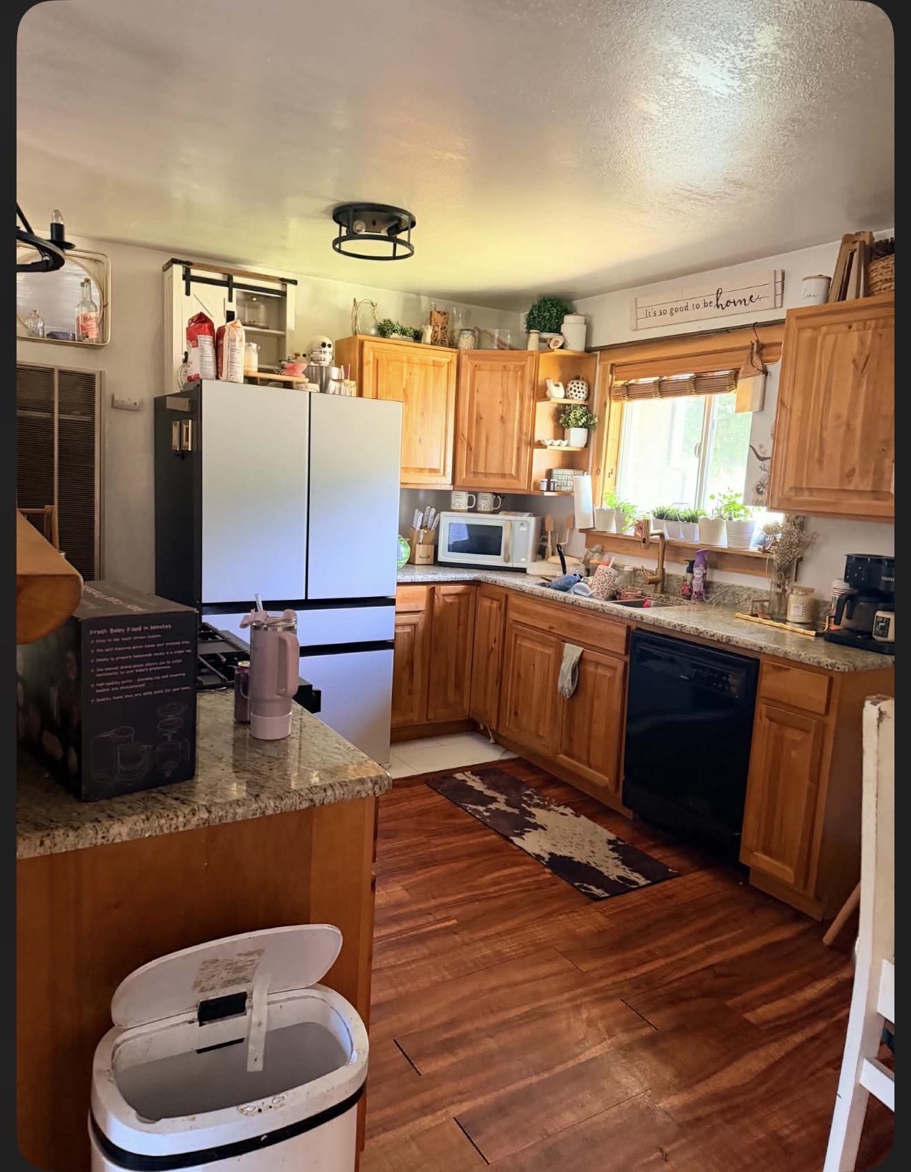 15440 Old Wagon Road Crescent Mills, CA 95934 - Photo 5 of 19 a kitchen with stainless steel appliances granite countertop a sink dishwasher a refrigerator with wooden cabinets and floor