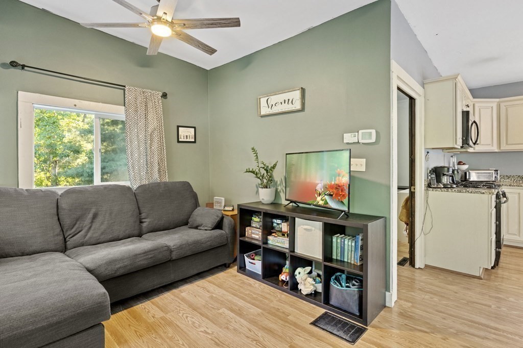 8 Squirrel Road Plymouth, MA 02360 - Photo 12 of 42 a living room with furniture and a flat screen tv