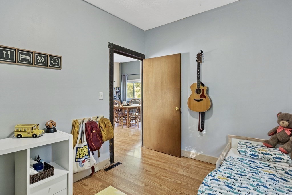 8 Squirrel Road Plymouth, MA 02360 - Photo 20 of 42 a bedroom with a bed and a table in it