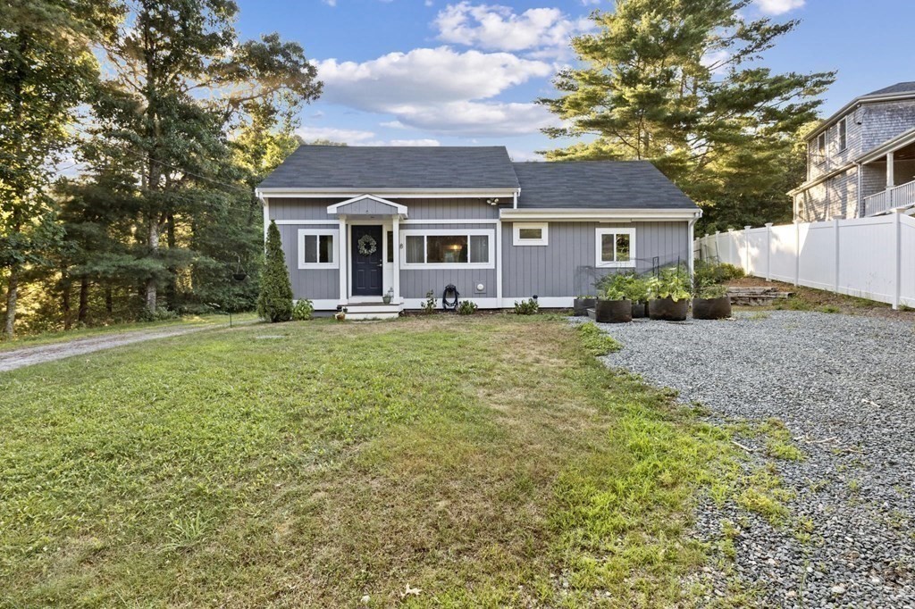 8 Squirrel Road Plymouth, MA 02360 - Photo 2 of 42 a view of a yard in front of a house with large tree