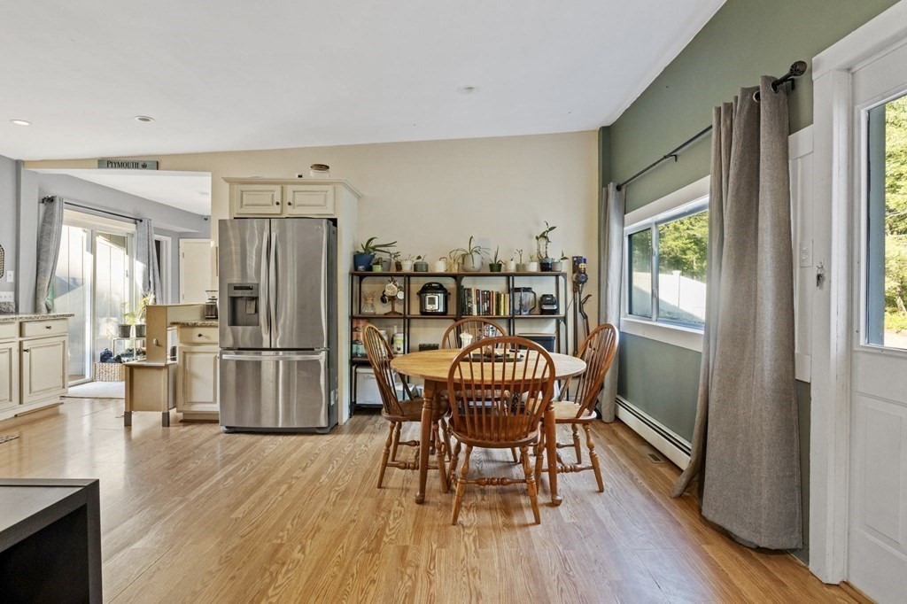 8 Squirrel Road Plymouth, MA 02360 - Photo 10 of 42 a view of a dining room with furniture window and wooden floor