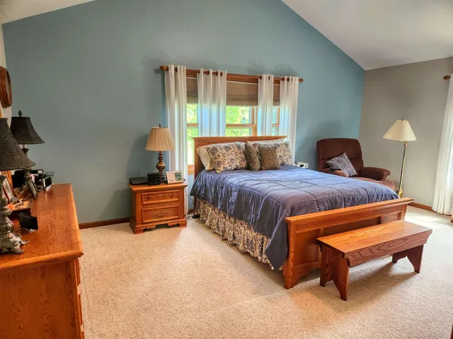 a bedroom with a bed and window