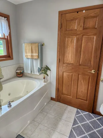 a bathroom with a tub and shower