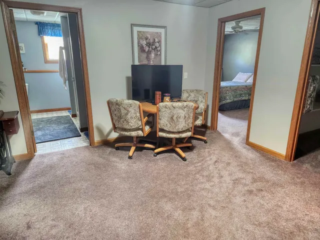 a view of a livingroom with furniture and a window