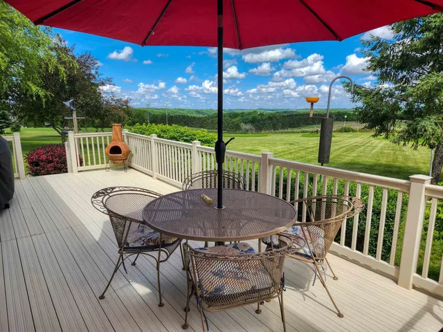 a view of a chairs and table in the deck