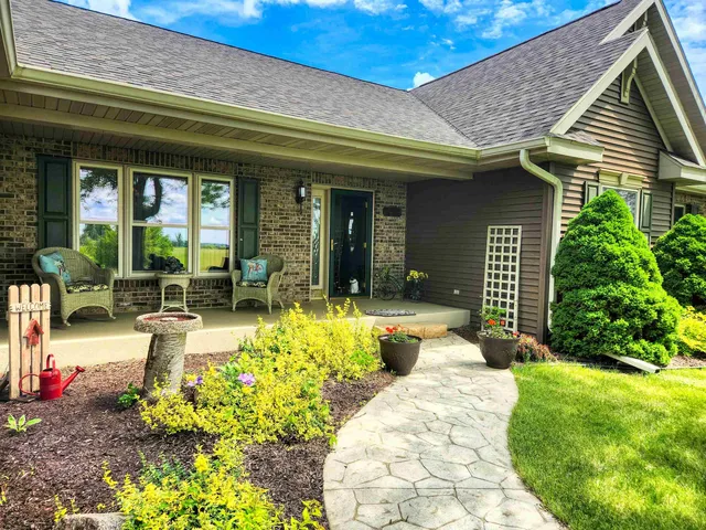 a view of a house with outdoor seating area