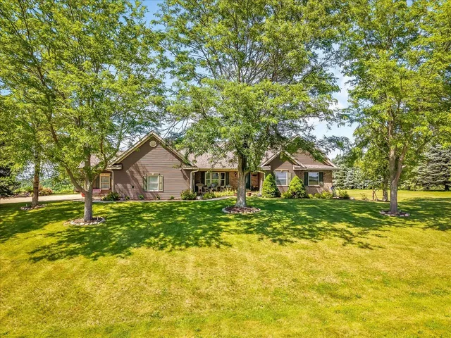 a yellow house in middle of forest