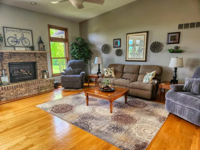 a living room with furniture and a fireplace