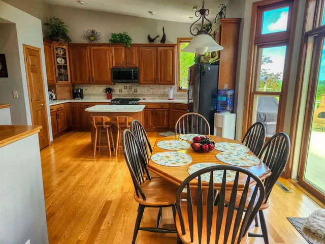 a dining room with furniture and window