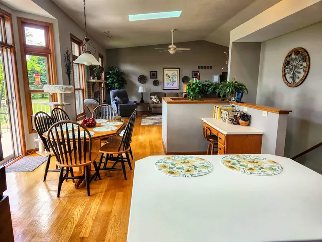 a dining room with a table and chairs