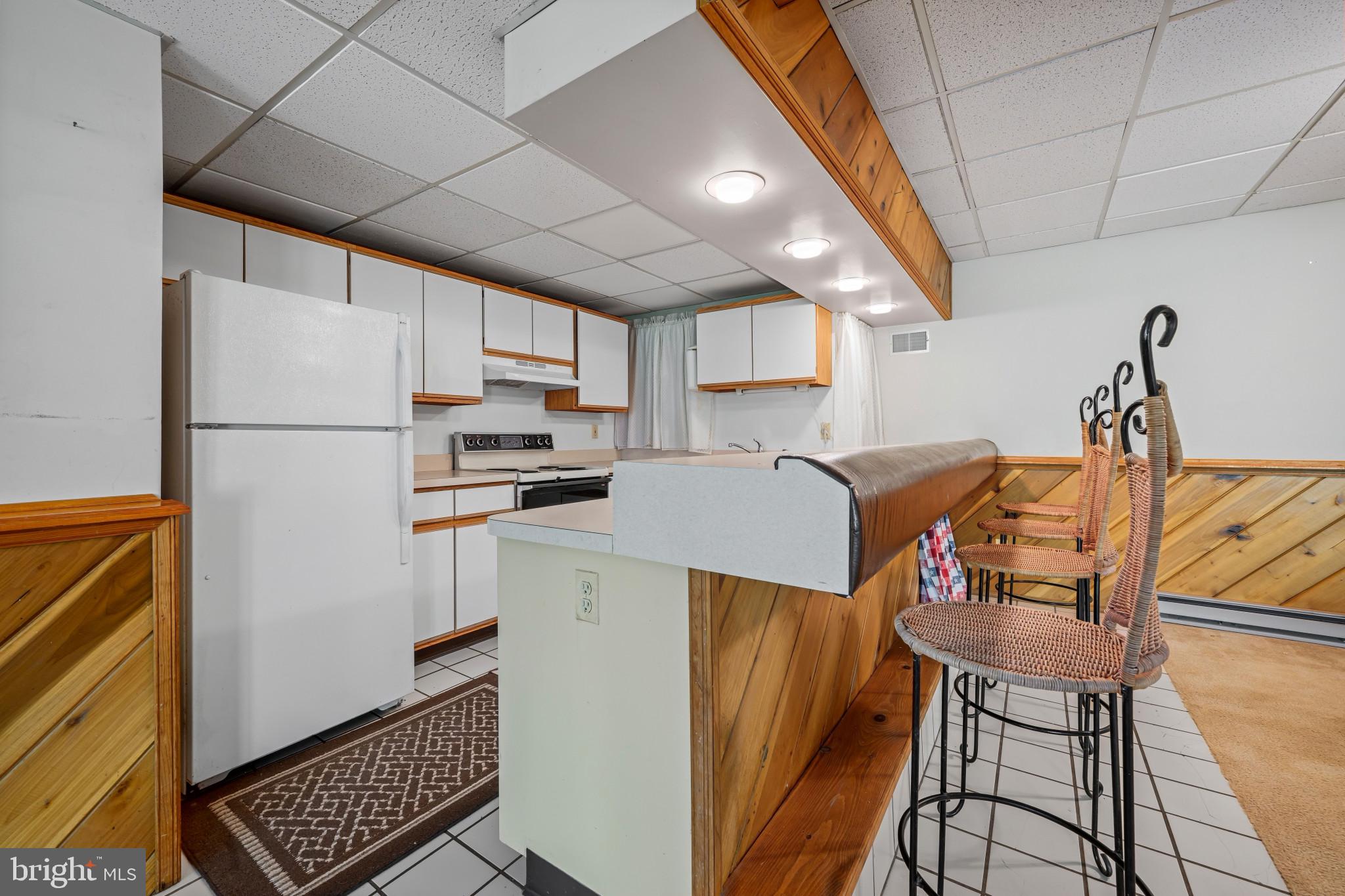5816 Oakland Road Sykesville, MD 21784 - Photo 35 of 59 Basement Kitchen and Bar