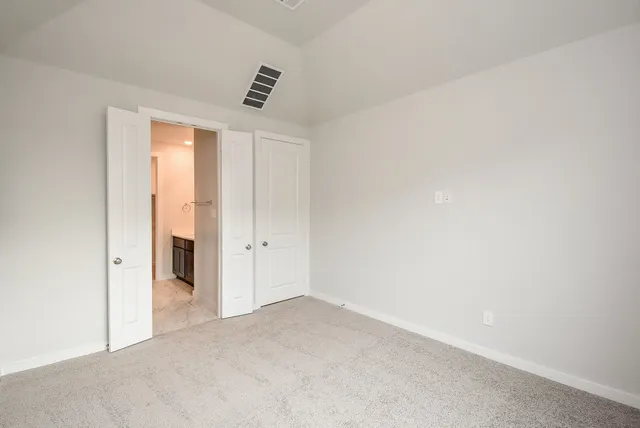 a bathroom with a glass door shower and a sink