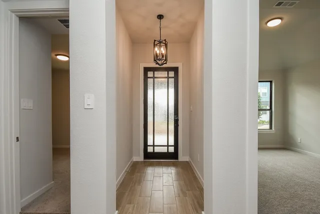 a view of a hallway with windows