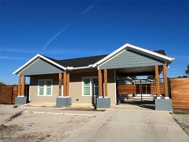 a front view of a house with parking