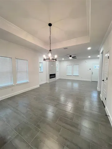 a view of a windows and a chandelier in a room