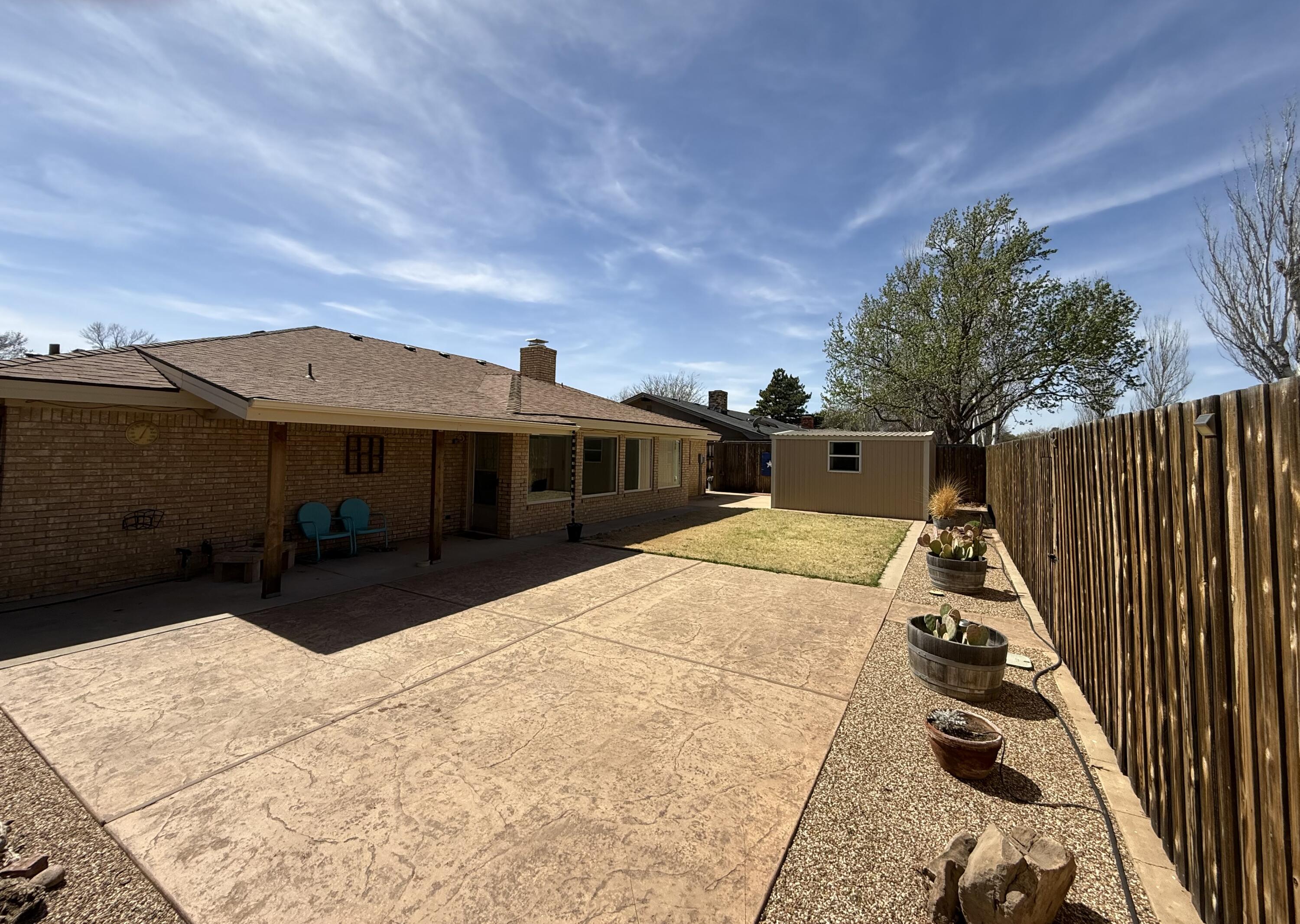3206 77th Street Lubbock, TX 79423 - Photo 30 of 35 a front view of a house with a yard