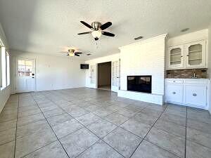 3206 77th Street Lubbock, TX 79423 - Photo 4 of 35 a view of a livingroom with a kitchen