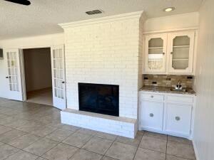 3206 77th Street Lubbock, TX 79423 - Photo 6 of 35 a spacious bathroom with a mirror and a fireplace