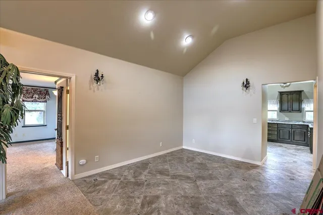 a view of a hallway with a kitchen