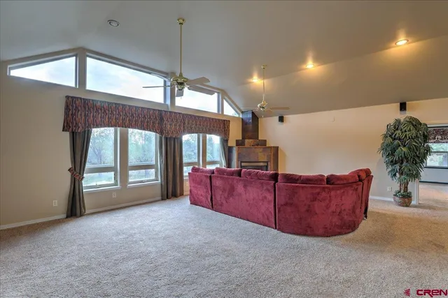 a living room with furniture window and wooden floor