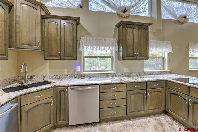 a kitchen with a sink and cabinets