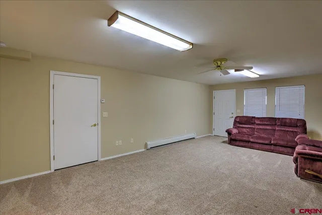 a room with a dresser and a chandelier