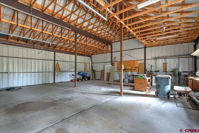 a view of a patio with table and chairs