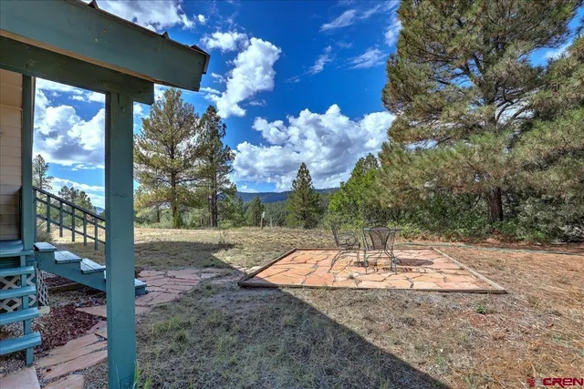 a backyard of a house with lots of green space
