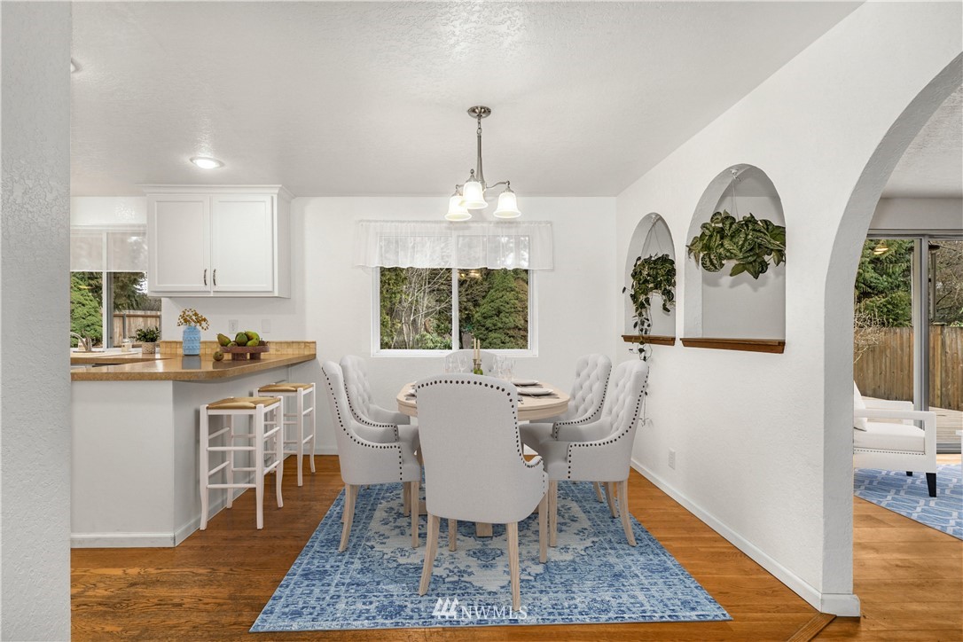 17409 29th Drive Southeast Bothell, WA 98012 - Photo 12 of 37 a dining room with wooden floor and a rug