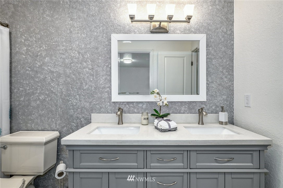 17409 29th Drive Southeast Bothell, WA 98012 - Photo 18 of 37 a bathroom with a sink and a toilet
