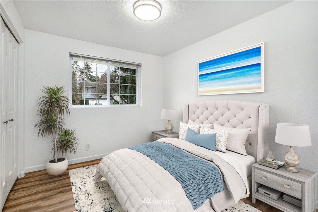 17409 29th Drive Southeast Bothell, WA 98012 - Photo 21 of 37 a bedroom with a bed and a potted plant
