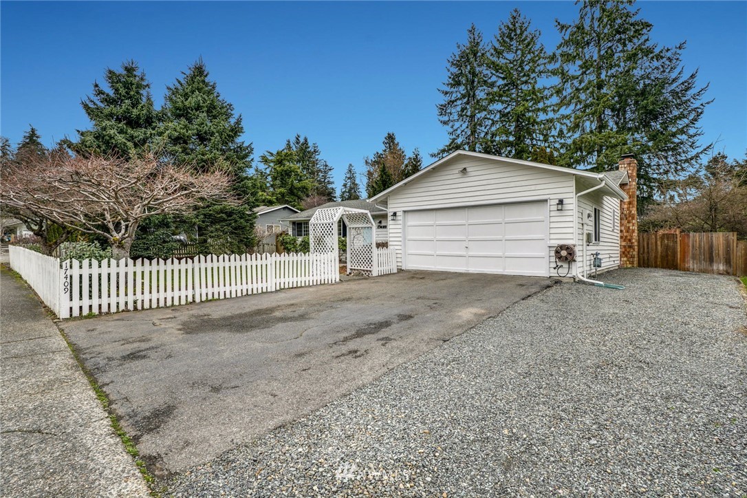 17409 29th Drive Southeast Bothell, WA 98012 - Photo 29 of 37 a view of a house with a small yard and a large tree