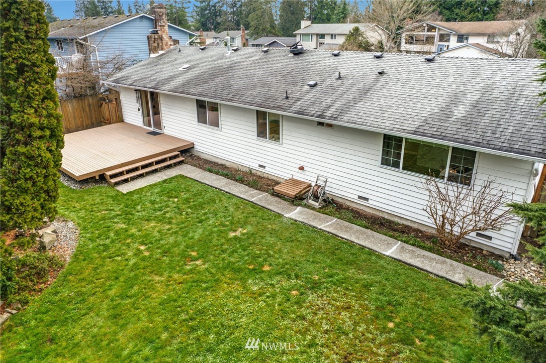 17409 29th Drive Southeast Bothell, WA 98012 - Photo 37 of 37 a view of a house with a backyard and a chair