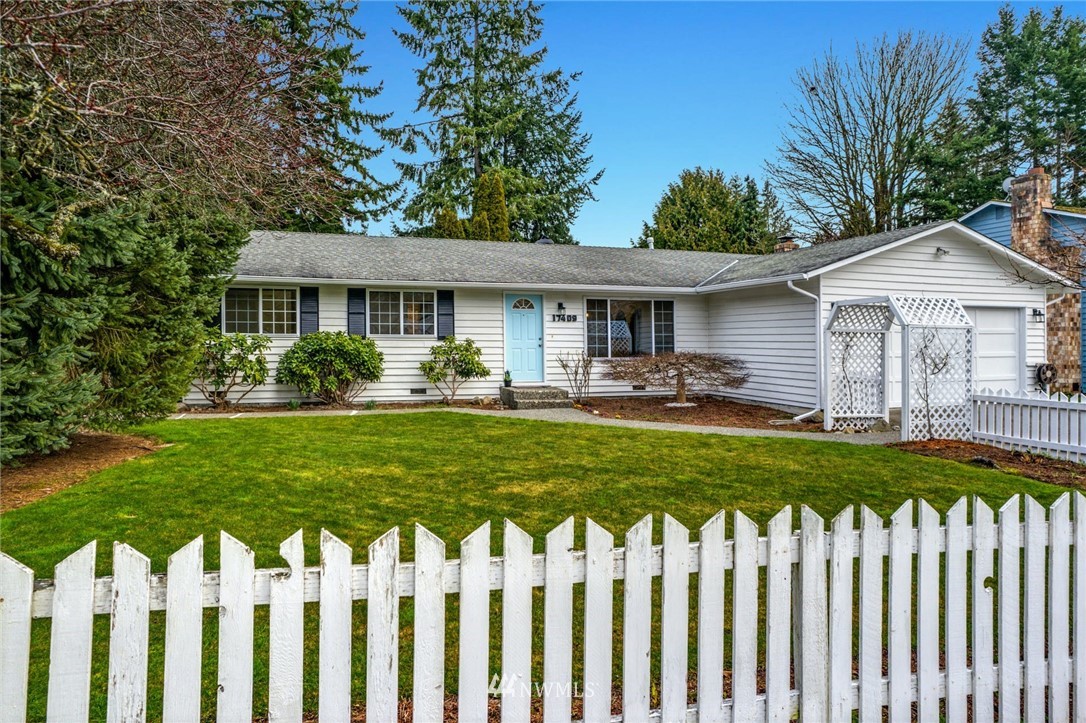 17409 29th Drive Southeast Bothell, WA 98012 - Photo 4 of 37 a front view of house with a garden and trees