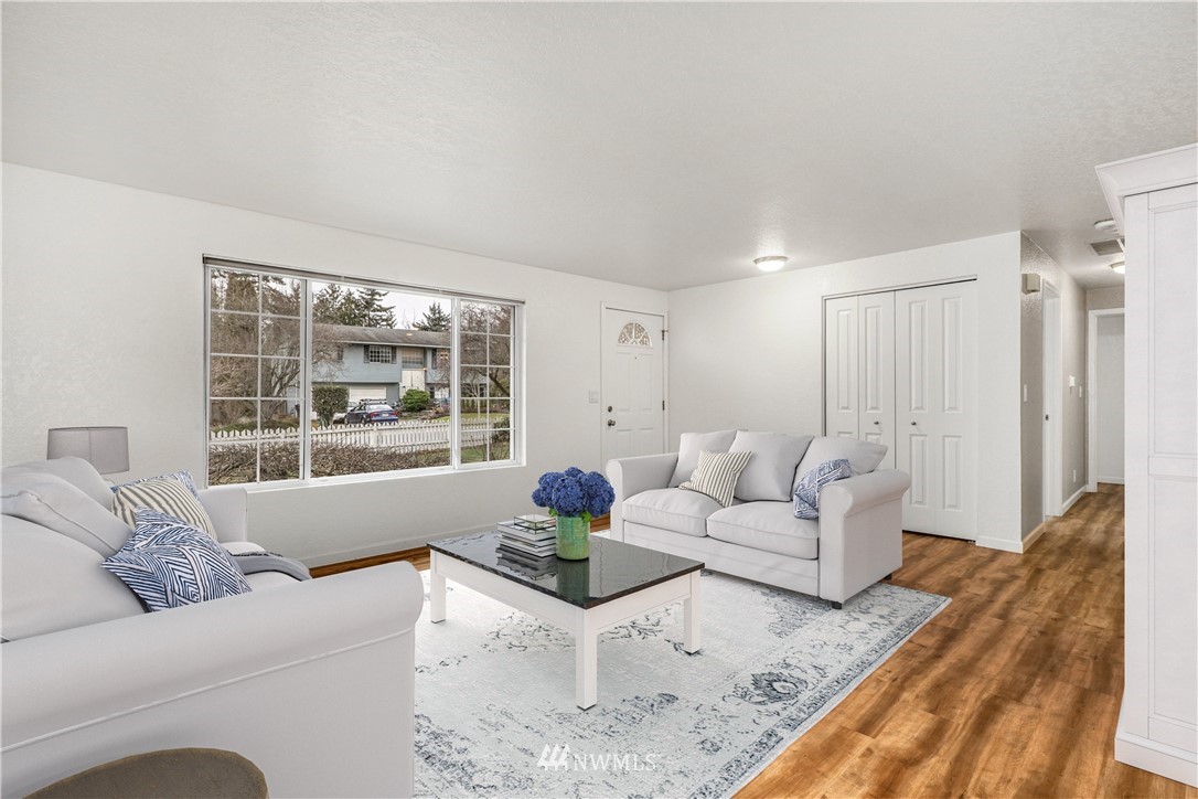 17409 29th Drive Southeast Bothell, WA 98012 - Photo 8 of 37 a living room with furniture and a large window