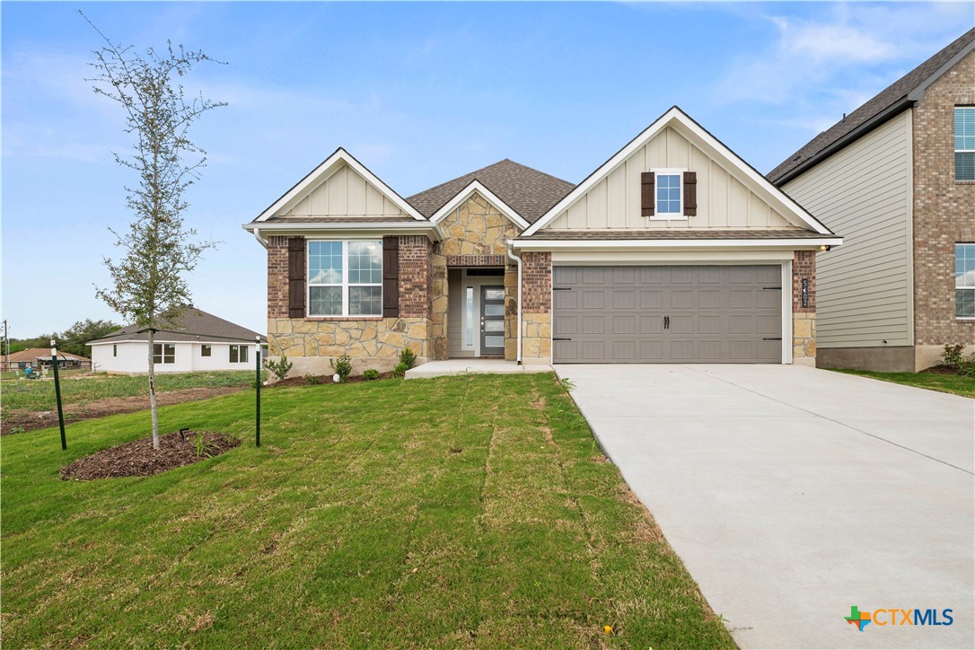 5102 Pollack Lane Belton, TX 76513 - Photo 1 of 30 a front view of a house with a yard and garage