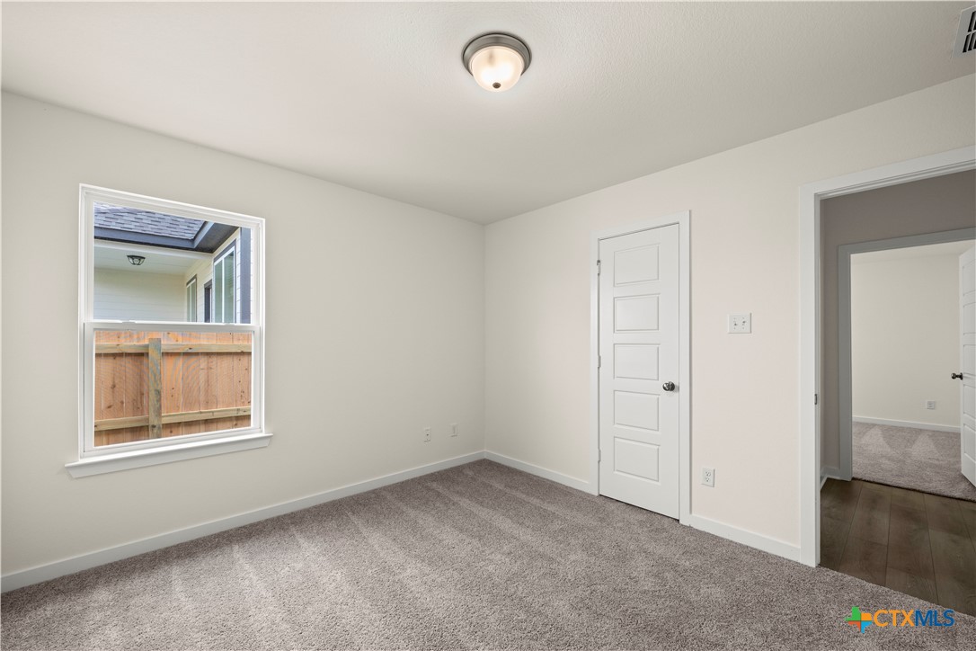 5102 Pollack Lane Belton, TX 76513 - Photo 13 of 30 an empty room with windows and closet