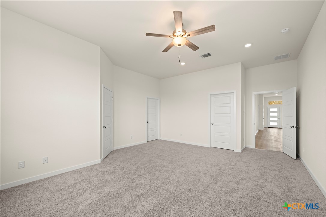 5102 Pollack Lane Belton, TX 76513 - Photo 19 of 30 an empty room with fan and view of bathroom