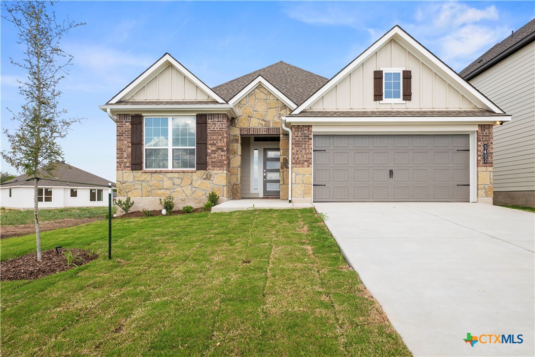 5102 Pollack Lane Belton, TX 76513 - Photo 2 of 30 a view of a yard in front of a house with plants