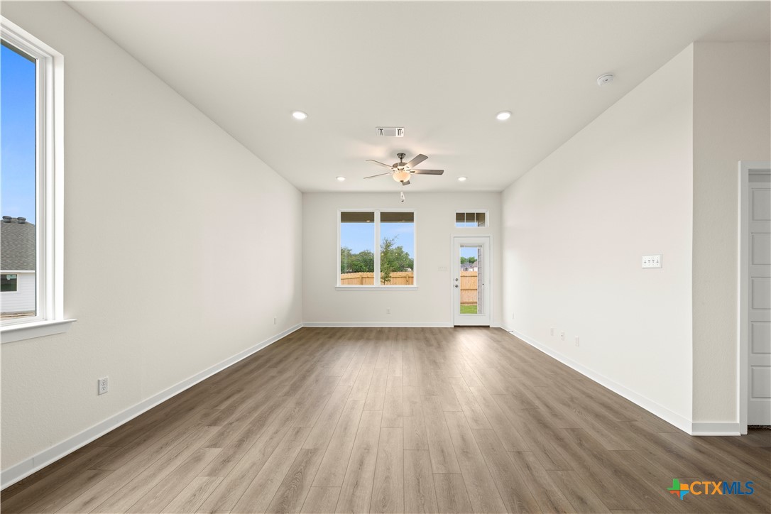 5102 Pollack Lane Belton, TX 76513 - Photo 26 of 30 an empty room with wooden floor and windows