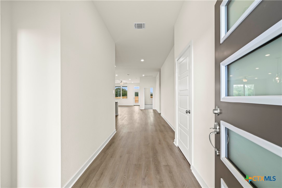 5102 Pollack Lane Belton, TX 76513 - Photo 5 of 30 a view of a hallway with wooden floor